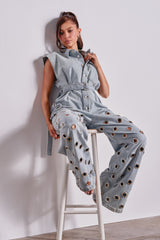 PLAY YOUR CARDS RIGHT DENIM JUMPSUIT WITH GROMMETS IN LIGHT WASH