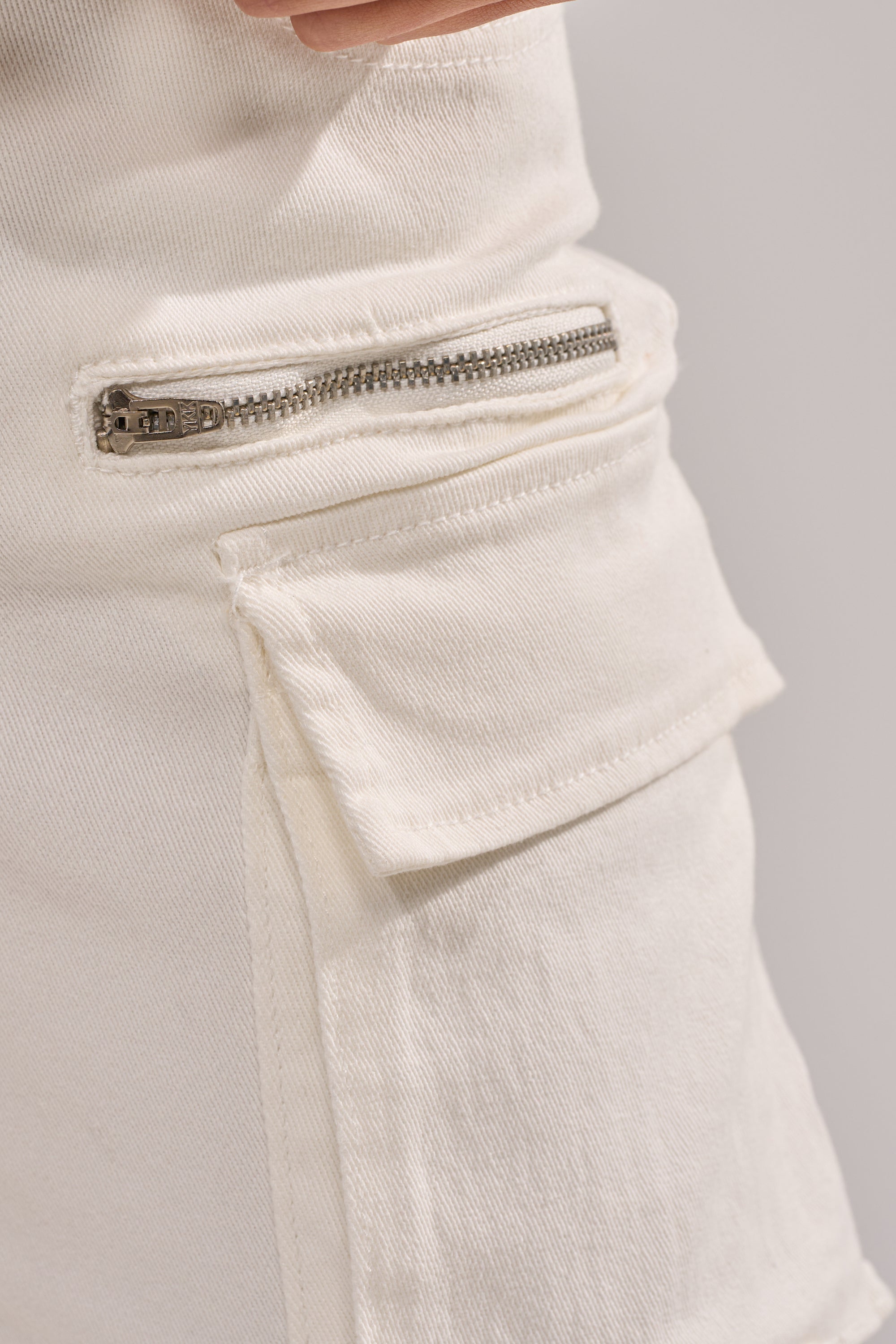 IT GETS EASIER STACKED CARGO PANT IN WHITE
