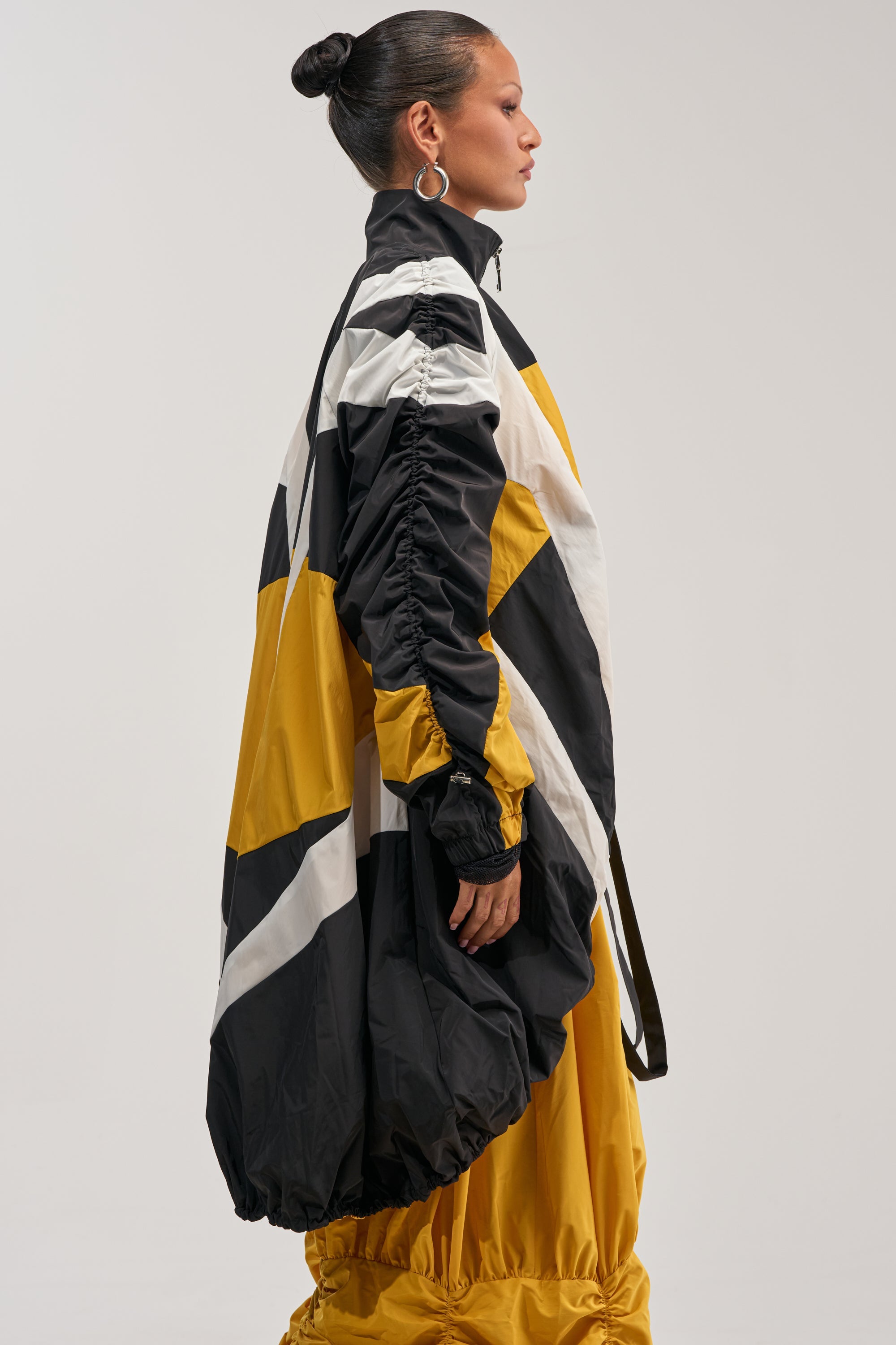 DON'T MIND ME HIGH LOW WINDBREAKER IN YELLOW