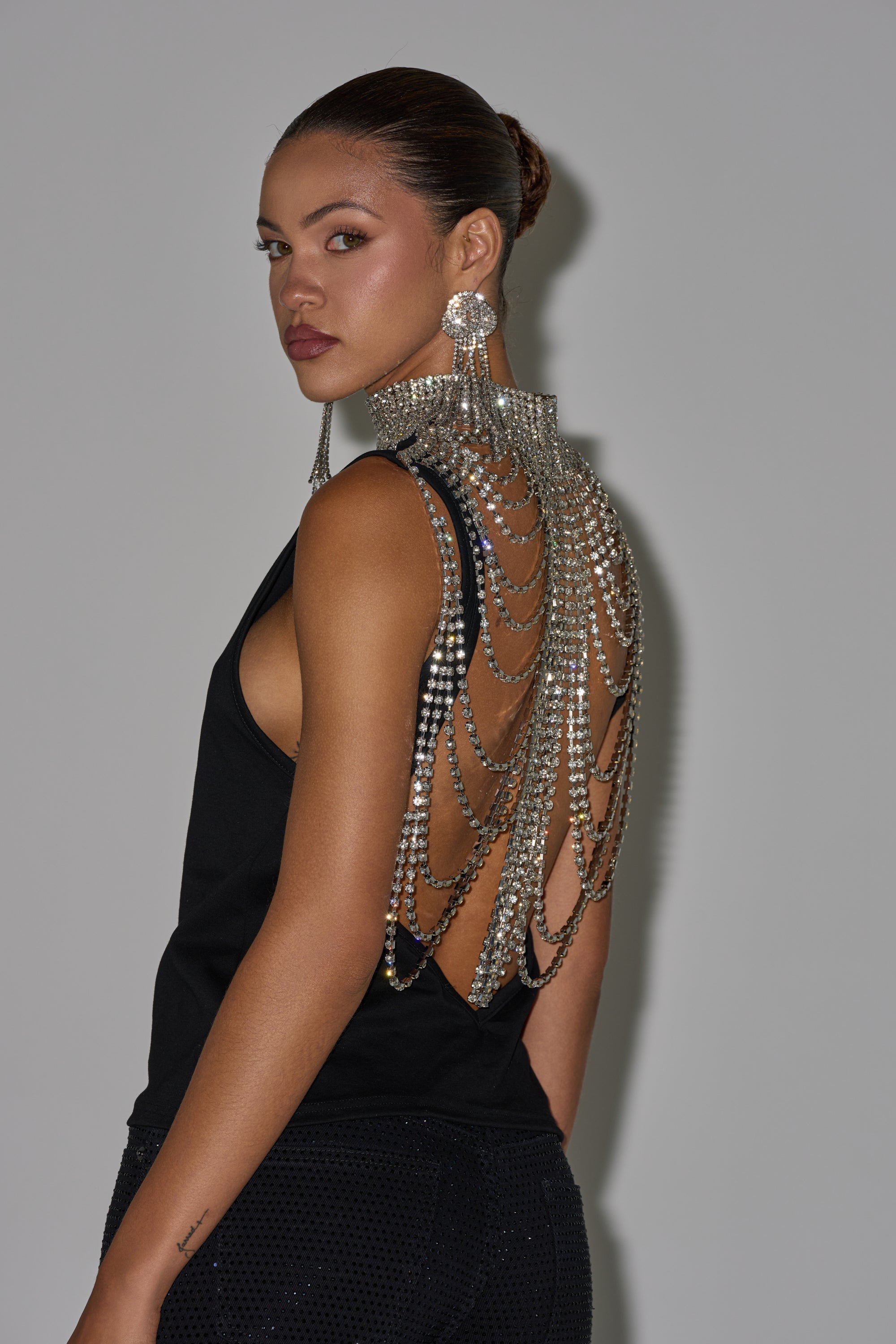 ONE OF ONE RHINESTONE SLEEVELESS TEE IN BLACK