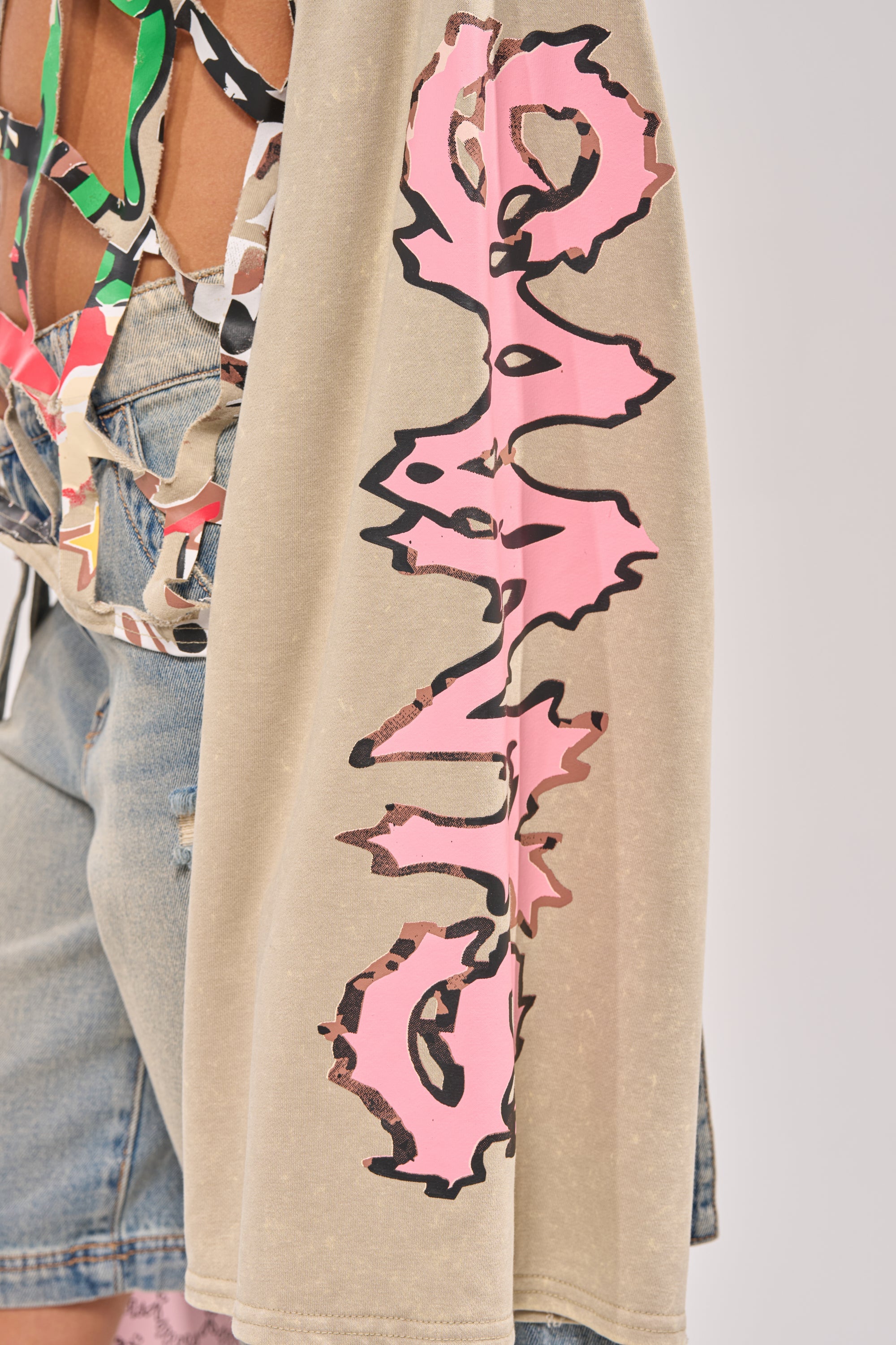 CAGED UP LONG SLEEVE GRAPHIC TEE
