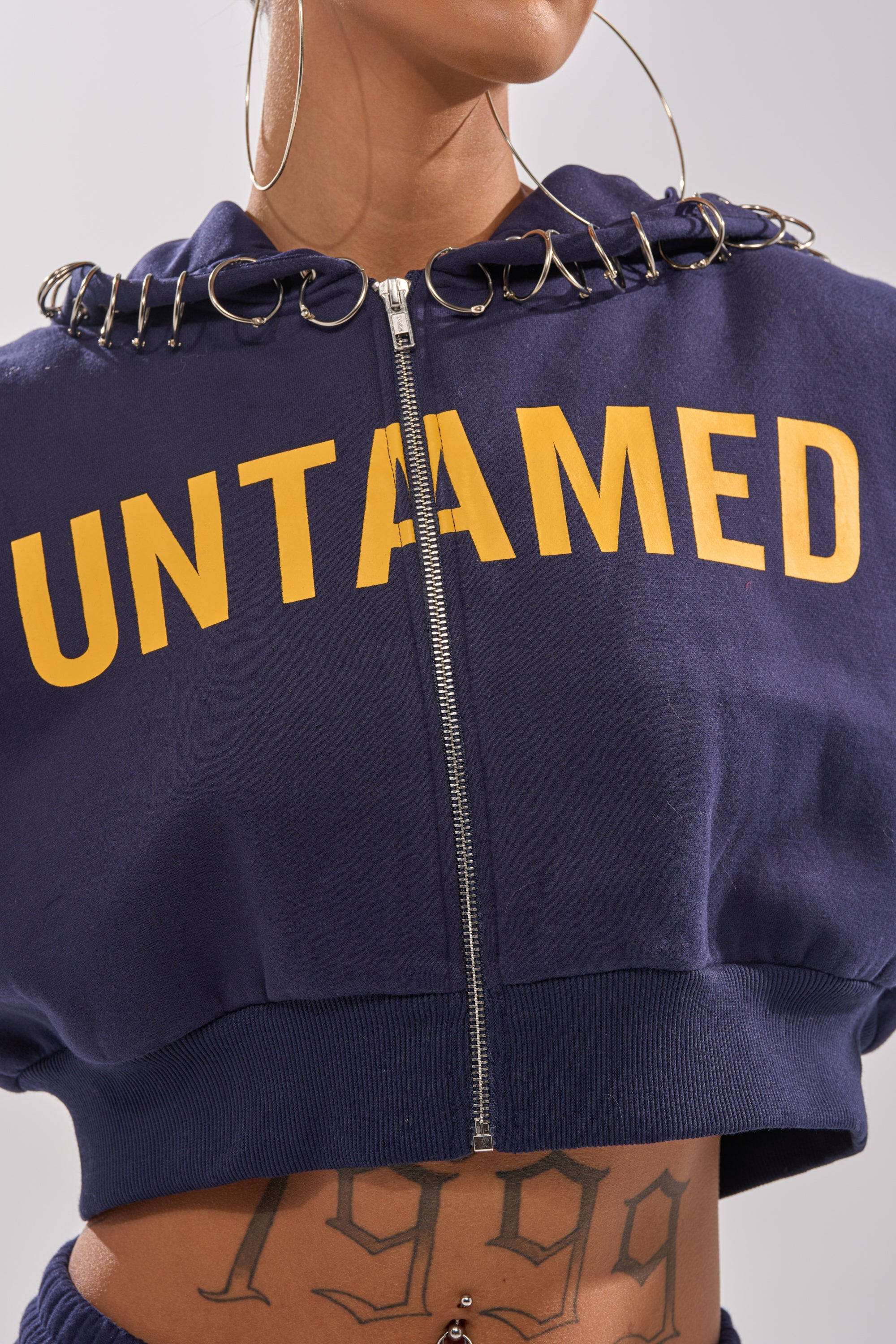 UNTAMED METAL RING SWEATSHIRT