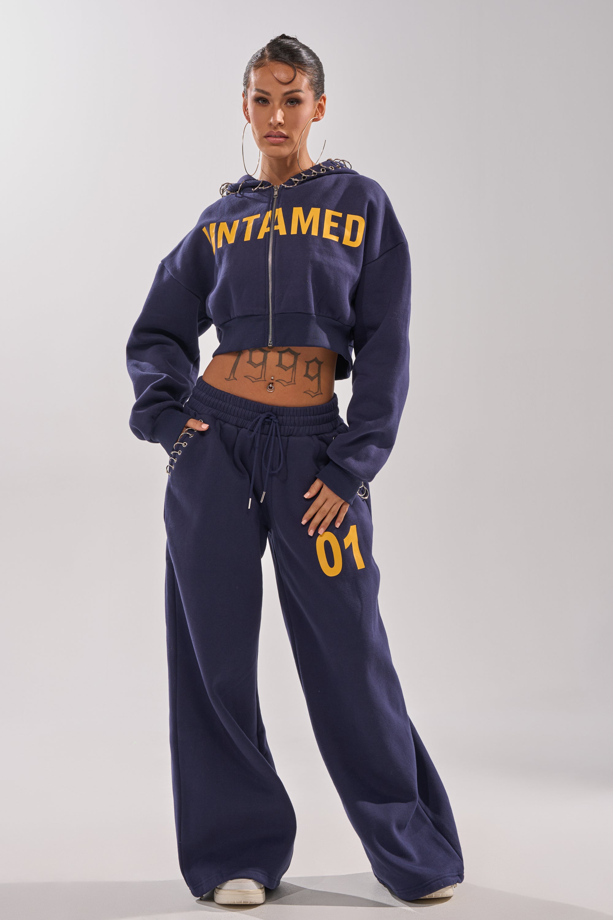UNTAMED METAL RING SWEATSHIRT