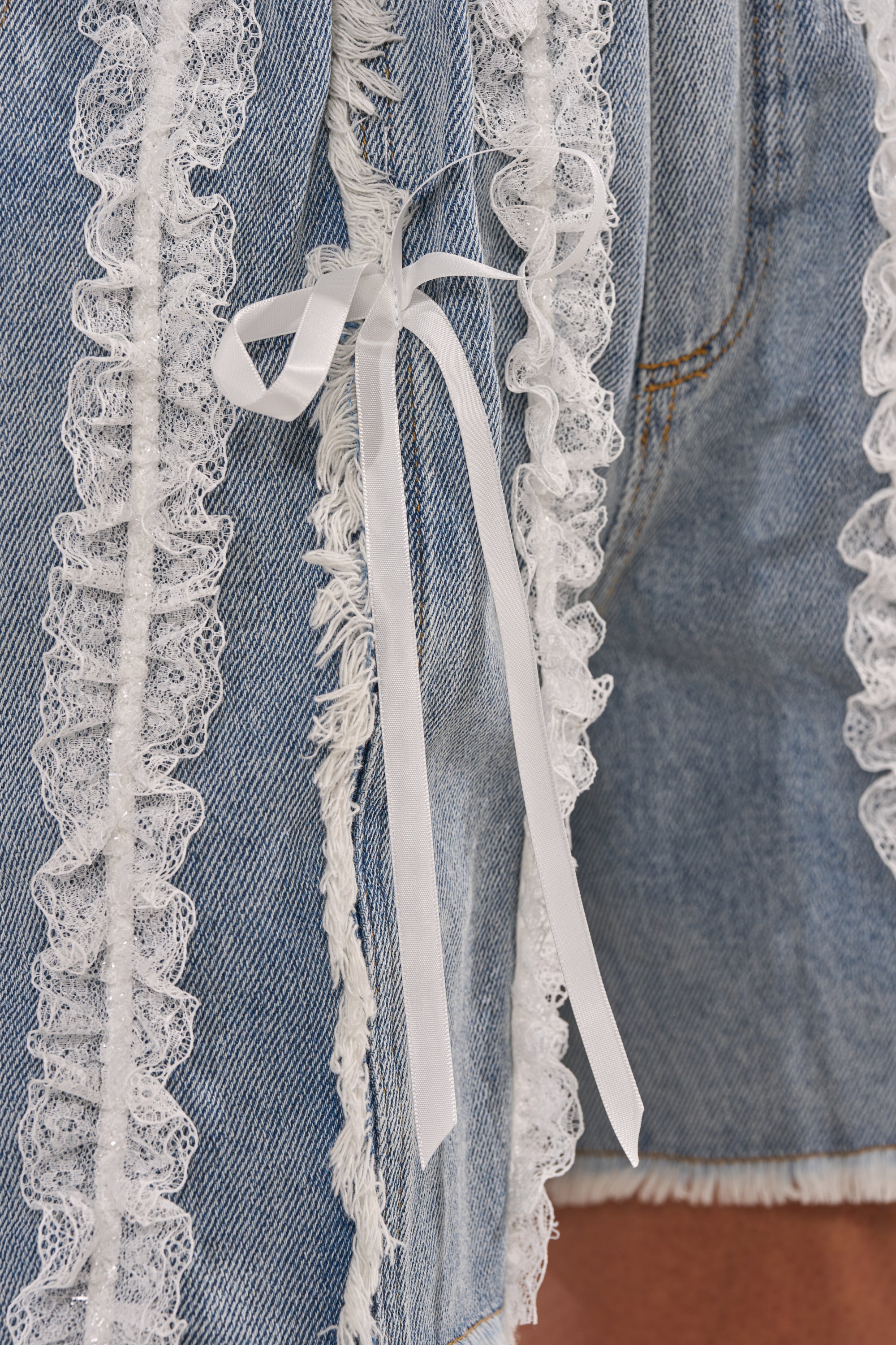 TIED AND LACED DENIM SHORTS