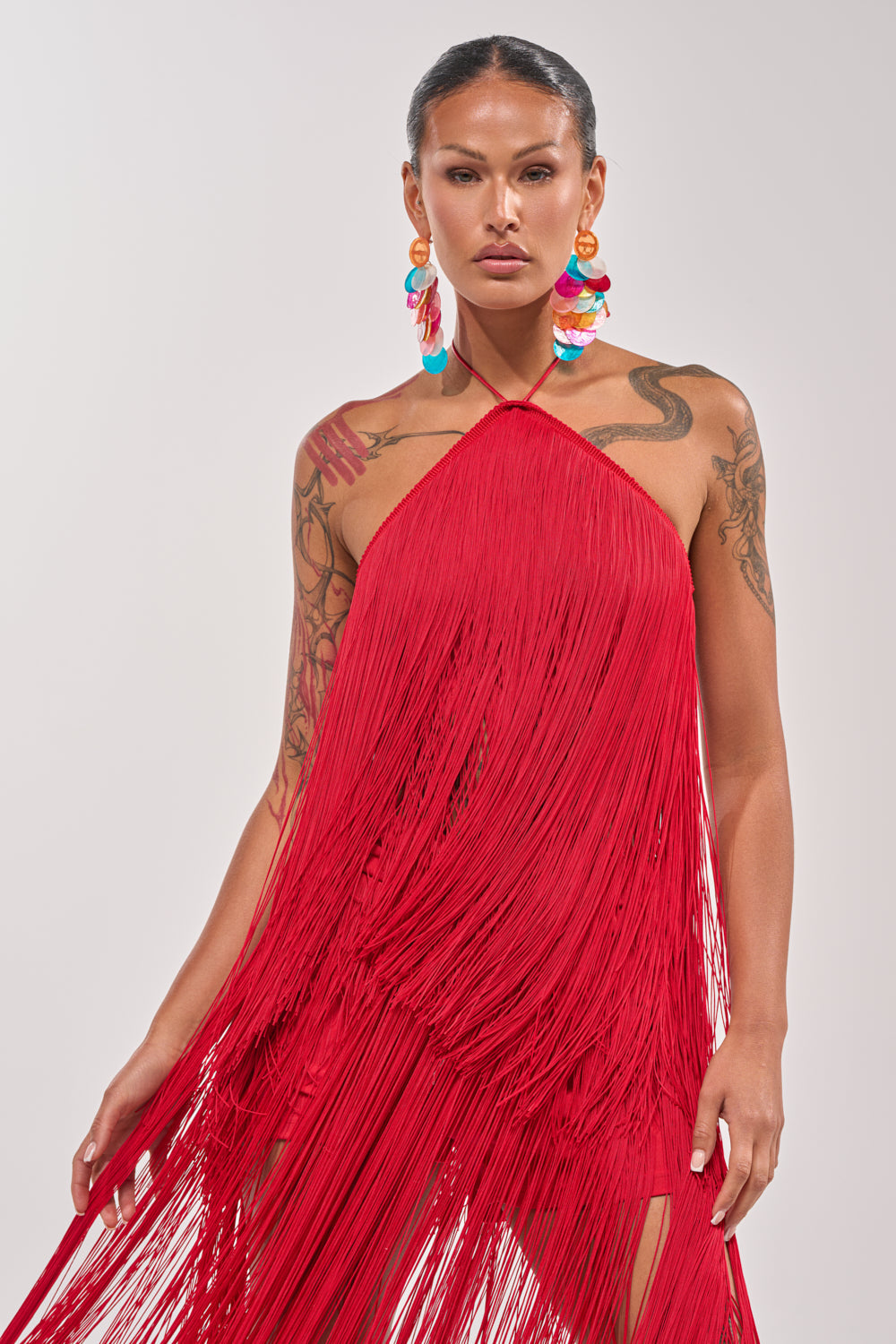 ON THE EDGE FRINGE HALTER TOP