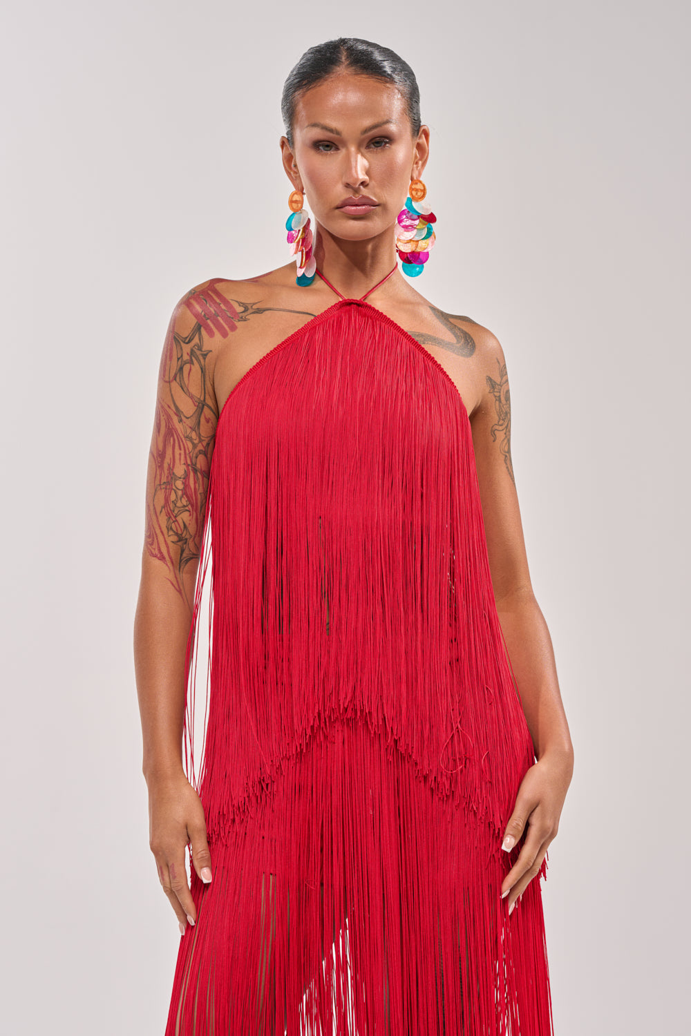 ON THE EDGE FRINGE HALTER TOP