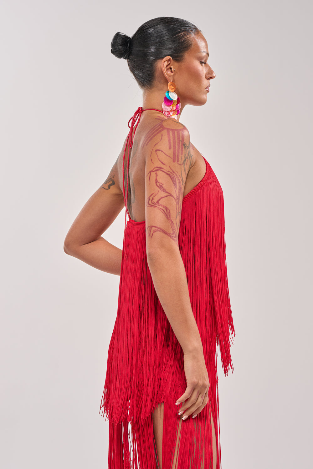 ON THE EDGE FRINGE HALTER TOP