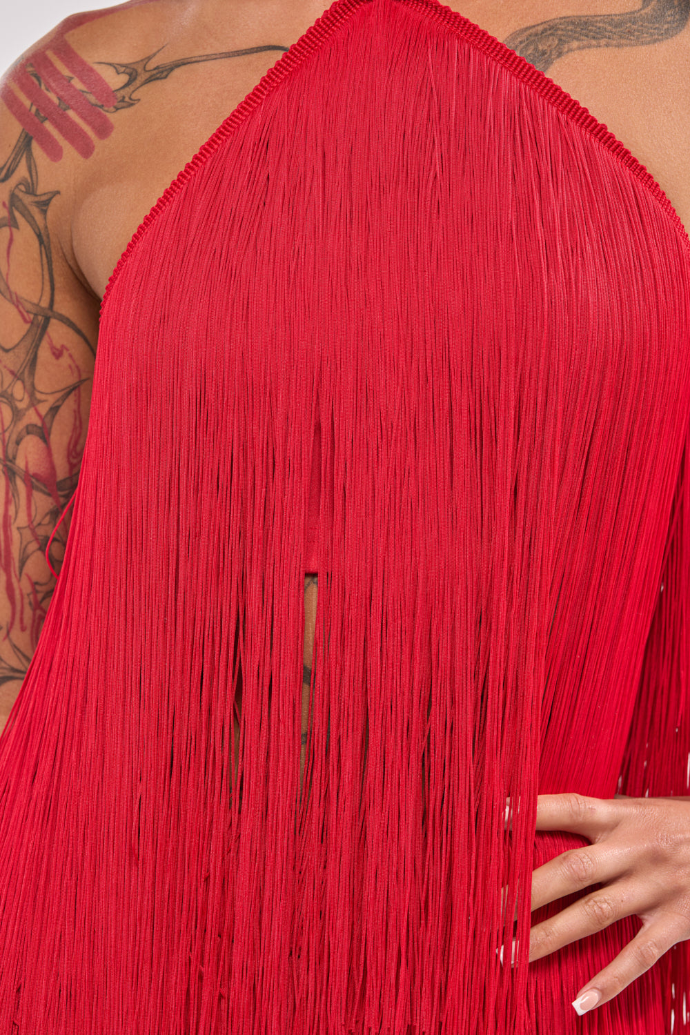 ON THE EDGE FRINGE HALTER TOP