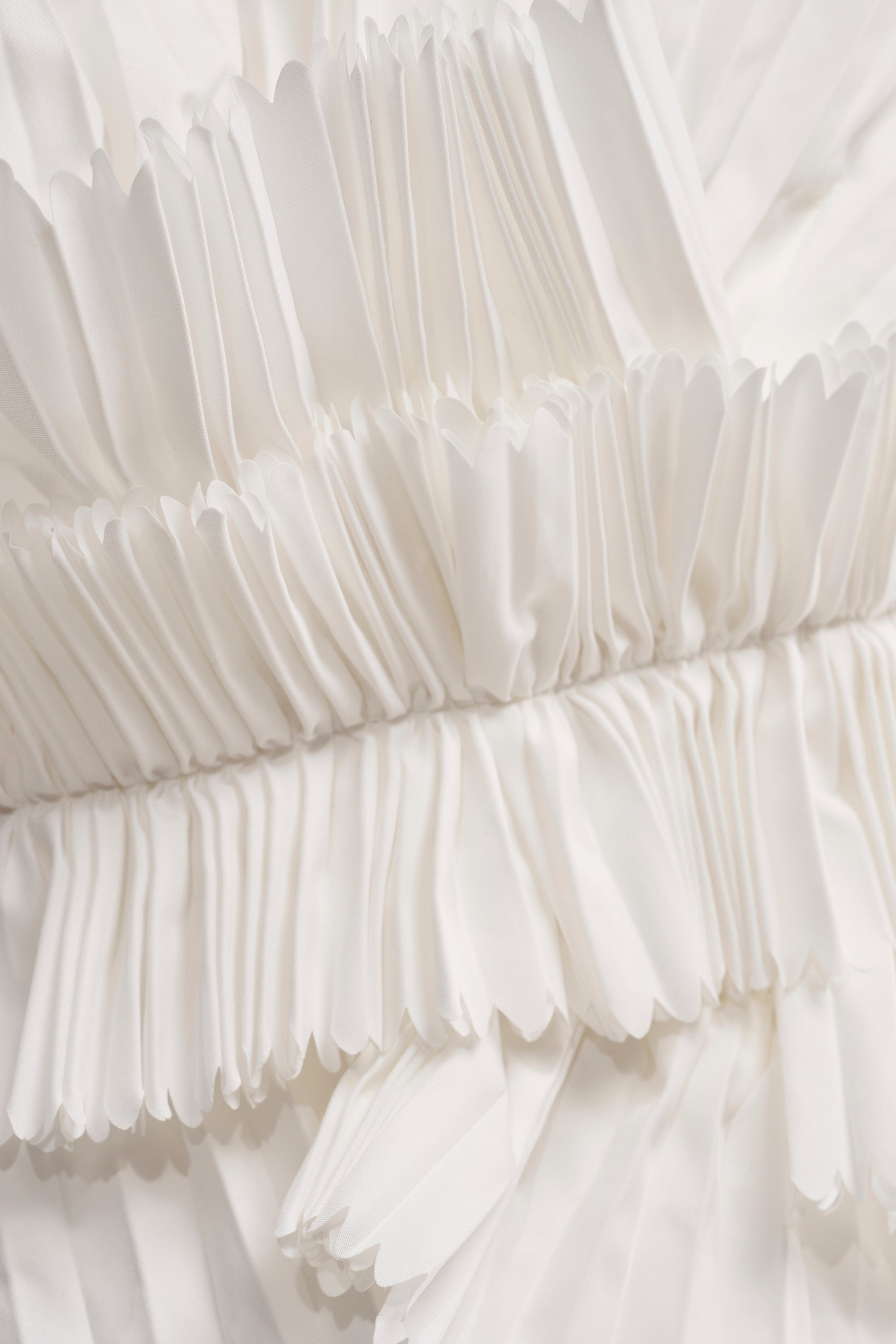 LUXURIOUS ASYMMETRICAL TOP IN WHITE